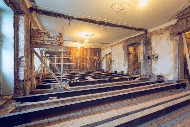 The Process Of Installing New Floor From Double-Tee Girder And Wooden Joist In Huge Room